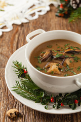 Traditional mushroom soup, made from porcini mushrooms. Christmas decoration.