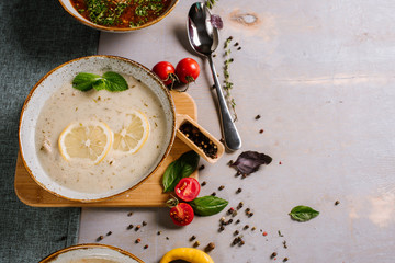 Tasty hot soup dish on the wooden background