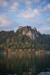 Fototapeta na wymiar Travailing around Lake Bled In Slovenia an amazing lake full of impressive nature , crystal blue water with a beautiful island in the middle surrounded by those beautiful mountains and trees. 