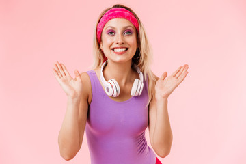 Obraz na płótnie Canvas Image of nice smiling woman throwing up hands with headphones