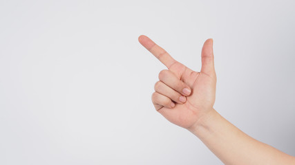 Male model is point the finger with right hand to do sign on white background.
