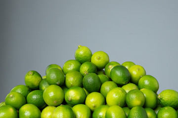 Limes on the grey isolated background