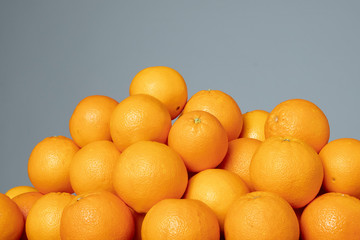 Full frame of oranges on the grey isolated background