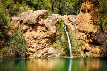 Pego do Inferno waterfall in Tavira, Portugal - Algarve Beautiful green lagoon