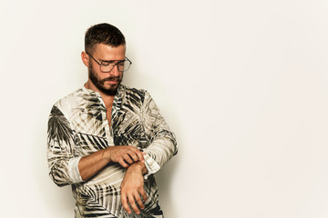 Fototapeta premium Young man with eyeglasses, looking down