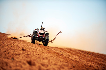 Hot heat summer sun ploughing fields in Kwazulu Natal South Africa, dusty movement blur, tractors, machinery © Megan Paine