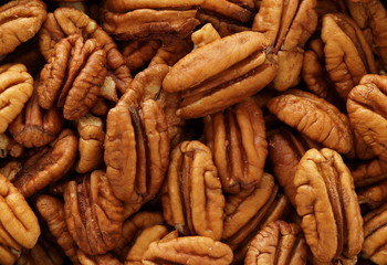 Pecan nuts close up full frame texture background. 