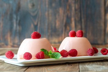 Dessert puddings with raspberries