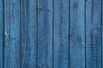Background of old painted boards with blue paint. Street lighting.