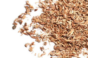 Dried chopped oak bark. Isolated on white background. Homeopathy.
