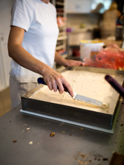 Woman decorating and make raspberry cookies in her home,stock photo
