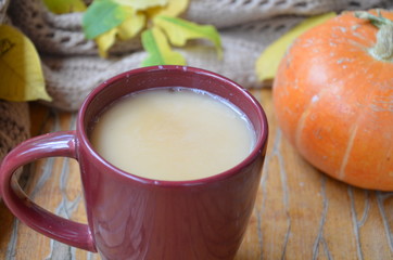 Pumpkin Spice Latte. Cup of Latte with Seasonal Autumn Spices, Cookies and Fall Decor. Traditional Coffee Drink for Autumn Holidays.