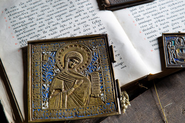 Bible and icons. Old book and icons of the 19th century .