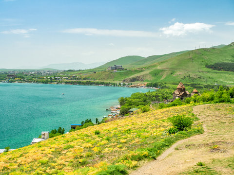 Footpath at the shore of lake Sevan leading to Sevanavank monastery