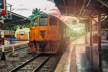 Obraz premium train station with train waiting for tourists to travel out of the province on weekends to relax