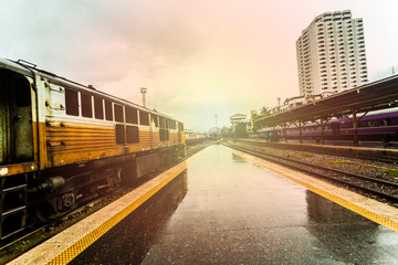 Fototapeta premium train station with train waiting for tourists to travel out of the province on weekends to relax