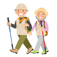 ノルディックウォーキングをする高齢者夫婦