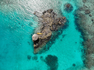 Aerial view of kayak on an island with turquoise waters