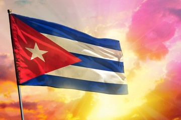 Fluttering Cuba flag on beautiful colorful sunset or sunrise background. Success concept.