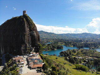 Aerial view of large rock formation and water