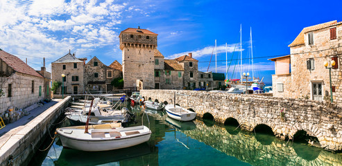Travel and landmarks of Croatia. Kastel Gomilica - old castle over the sea, popular tourist attraction near Split. Damatia