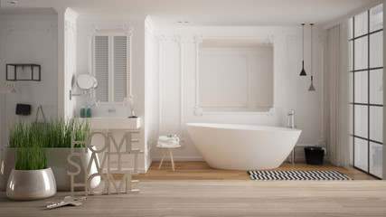 Wooden table, desk or shelf with potted grass plant, house keys and 3D letters making the words home sweet home, over modern white bathroom, interior design, blur background