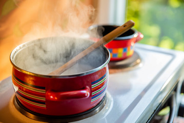 Preparing meal at home on a simple small stove