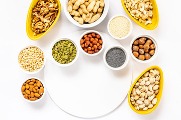 Top View of Variety of Nuts and Seeds on the White Background, Free Space for Text