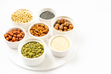 Top View of Variety of Nuts and Seeds on the White Background