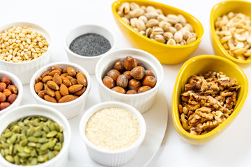 Various of Nuts and Seeds on White Background in the Bowls - Image