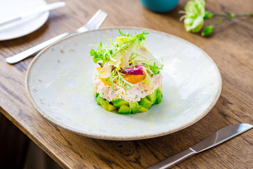 Layer Salad with Shrimps, Crab and Avocado in Luxury Restaurant