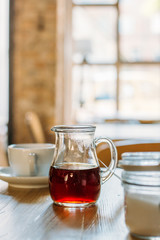 A Cup of Coffee on the Wooden Table in Modern Hipster Cosy Cafeteria