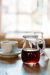 A Cup of Coffee on the Wooden Table in Modern Hipster Cosy Cafeteria