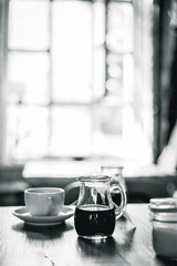 A Cup of Coffee on the Wooden Table in Modern Hipster Cosy Cafeteria