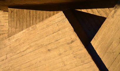 Photo of a stone geometric structure at the sunset. Texture.
