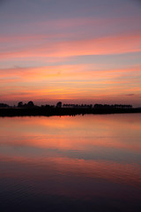 Fototapeta na wymiar Sunset over lake in Dutch province Friesland