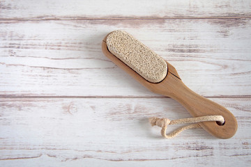 Pumice on a wooden background, zero waste concept. Copy space