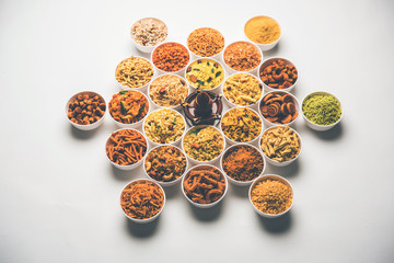 Rangoli of Farsan/snacks in bowls for Diwali with diya