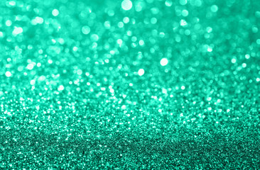 Abstract composition. Trendy mint green glitter light background with beautiful bokeh