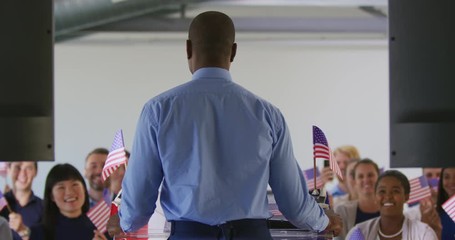 Male speaker and audience at political convention