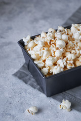 Traditional popcorn in a metal bowl. Rustic style