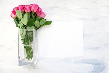 Pink Rose Bouquet in Glass Vase on White Table