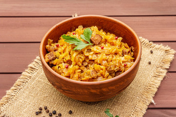 Stewed (braised) cabbage served on ethnic ceramic bowl