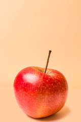 red apple -on a beige background