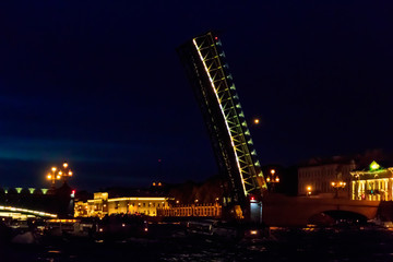 Fototapeta na wymiar Opening of Trinity drawbridge. Night view of Trinity bridge from the Neva river in St. Petersburg, Russia