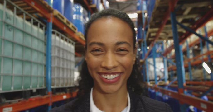 Portrait of young female manager in a warehouse