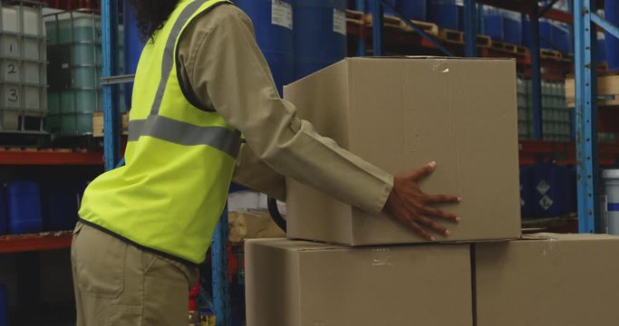 Young female male worker in a warehouse