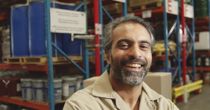 Middle aged male worker in a warehouse