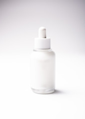 White glass cosmetic bottle mock-up with blank copy space