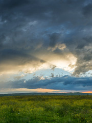 Obraz na płótnie Canvas Sunrays over golden sunset landscape panorama